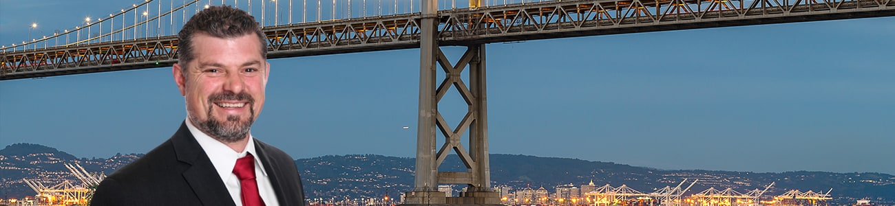Spencer C. Young picture over background of San Francisco-Oakland Bay Bridge